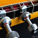 Home 20 기타 튜닝 머신 종류 - **Image Prompt 1: The Evolution of Guitar Tuning Pegs**
A split image, showcasing the contrast b...